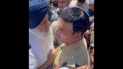A Punjab Police personnel taking Shiromani Akali Dal chief Sukhbir Singh Badal into preventive custody near Gurdwara Amb Sahib in Mohali on Wednesday. (HT Photo) A Punjab Police personnel taking Shiromani Akali Dal chief Sukhbir Singh Badal into preventive custody near Gurdwara Amb Sahib in Mohali on Wednesday. (HT Photo)
