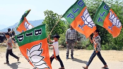 Children hold BJP flags during an election rally ahead of Lok Sabha Polls. (File photo/ANI)