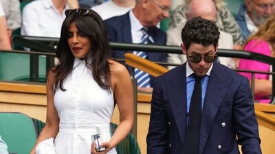 Priyanka Chopra and Nick Jonas arrive in the Royal Box at Centre Court during the Wimbledon Tennis Championships. AP/PTI(AP07_02_2025_000297A) (AP) Priyanka Chopra and Nick Jonas arrive in the Royal Box at Centre Court during the Wimbledon Tennis Championships. AP/PTI(AP07_02_2025_000297A) (AP)