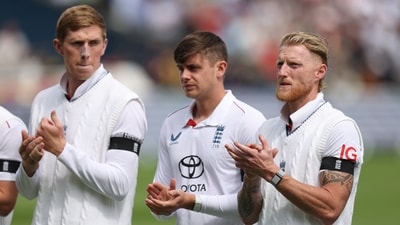 England's Ben Stokes applauds with teammates as they line up during the national anthems before the match (Action Images via Reuters)