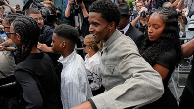 Diddy's daughters and son Justin were smiling with joy as the mob of media and fans surrounded them. (AP)