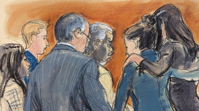 Sean 'Diddy' Combs defense team surrounds him as they discuss the jury note regarding a verdict on counts two, three, four and five, in Manhattan federal court, Tuesday, July 1, 2025, in New York. (Elizabeth Williams via AP) (AP)