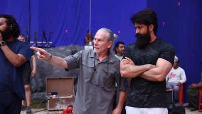 Yash with Hollywood stunt director Guy Norris on the sets of India's most expensive film. Yash with Hollywood stunt director Guy Norris on the sets of India's most expensive film.