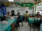 People dine at Ravi restaurant in Satwa district of Dubai, United Arab Emirates, Monday, June 9, 2025. 