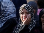 Mourners react during the funeral of Palestinians, who, according to Gaza's health ministry, were killed in an overnight Israeli strike on a tent, at Nasser Hospital in Khan Younis, southern Gaza Strip.