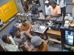 Screengrab of a viral video where four men in Bengaluru was seen assaulting a coffee shop worker
