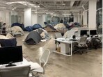 Photographs that show tents pitched inside an office went viral on X this week. Photographs that show tents pitched inside an office went viral on X this week.