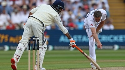 Woakes points to something on the crease in front of India's Ravindra Jadeja, on day two of the second cricket test match (AFP) Woakes points to something on the crease in front of India's Ravindra Jadeja, on day two of the second cricket test match (AFP)