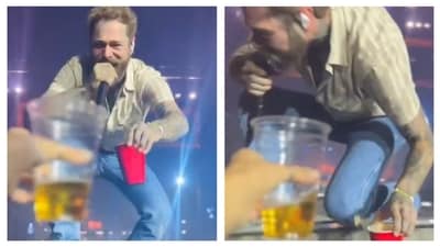 Post Malone fell off the stage during his recent concert in Arizona while interacting with a fan. Post Malone fell off the stage during his recent concert in Arizona while interacting with a fan.