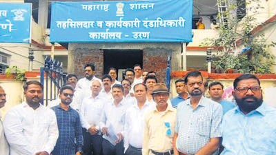 Navi Mumbai, India - July 3, 2025:Sudhakar Patil explaining the provisions of Govt resolution to Tahsildar Third Mumbai villagers protest succeeds in getting `acquisition of uncultivated landÕ notices withdrawn in Navi Mumbai, India, on Thursday, July 3, 2025. (Photo by Bachchan Kumar/ HT PHOTO) (HT PHOTO) Navi Mumbai, India - July 3, 2025:Sudhakar Patil explaining the provisions of Govt resolution to Tahsildar Third Mumbai villagers protest succeeds in getting `acquisition of uncultivated landÕ notices withdrawn in Navi Mumbai, India, on Thursday, July 3, 2025. (Photo by Bachchan Kumar/ HT PHOTO) (HT PHOTO)
