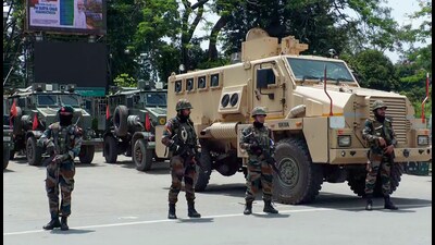 Security forces stand guard after the overnight violence that erupted in five districts of Imphal Valley in June. (ANI PHOTO) Security forces stand guard after the overnight violence that erupted in five districts of Imphal Valley in June. (ANI PHOTO)