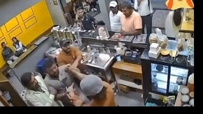 Screengrab of a viral video where four men in Bengaluru was seen assaulting a coffee shop worker Screengrab of a viral video where four men in Bengaluru was seen assaulting a coffee shop worker