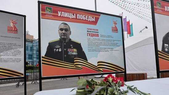 A view shows flowers placed in front of a board with a photograph of Major General Mikhail Gudkov, in the far eastern city of Vladivostok, Russia. (REUTERS)