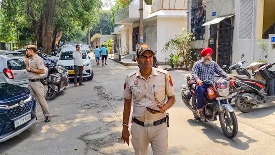 Police personnel during an investigation after a woman and her teenage son were killed allegedly by their domestic help at their home at Lajpat Nagar in New Delhi on Thursday, July 3, 2025. (PTI)