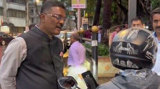 Maharashtra Transport Minister Pratap Sarnaik confronts a bike taxi rider in Mumbai after booking a ride undercover to expose illegal operations. (X/@PratapSarnaik)