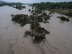 A raging Guadalupe River leaves fallen trees and debris in its wake, Friday, July 4, 2025, in Kerrville, Texas. A raging Guadalupe River leaves fallen trees and debris in its wake, Friday, July 4, 2025, in Kerrville, Texas.