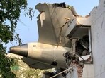 The tail of Air India flight 171 is pictured after it crashed in a residential area near the airport in Ahmedabad on June 12, 2025. The tail of Air India flight 171 is pictured after it crashed in a residential area near the airport in Ahmedabad on June 12, 2025.