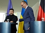 German Chancellor Friedrich Merz (R) and Ukrainian President Volodymyr Zelensky leave after giving a joint press conference at the Chancellery in Berlin on May 28, 2025. German Chancellor Friedrich Merz (R) and Ukrainian President Volodymyr Zelensky leave after giving a joint press conference at the Chancellery in Berlin on May 28, 2025.