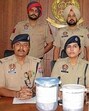 Khanna police officials with the seized drugs. (HT Photo) Khanna police officials with the seized drugs. (HT Photo)