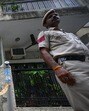 Police officials were seen outside the house in F Block, Lajpat Nagar I, where the bodies of a mother and her son were found on Wednesday night in New Delhi, on Thursday. (Sanchit Khanna/HT)