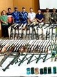 Security forces in Manipur pose with the arms cache after its recovery.
