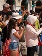 Tourists shield themselves from the beating sun in Athens, Greece. (Bloomberg)