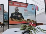 A view shows flowers placed in front of a board with a photograph of Major General Mikhail Gudkov, the deputy head of the Russian Navy who, according to local authorities, was recently killed in the Kursk region amid Russia-Ukraine conflict.