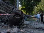 Women stand next to the wreckage of a car following mass Russian drone and missile strikes on Ukraine's capital Kyiv on July 4, 2025, amid the Russian invasion of Ukraine. Women stand next to the wreckage of a car following mass Russian drone and missile strikes on Ukraine's capital Kyiv on July 4, 2025, amid the Russian invasion of Ukraine.