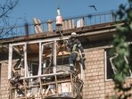 A rescue worker at the site of a Russian air strike on a residential building in Kyiv, Ukraine, on Friday, July 4, 2025.