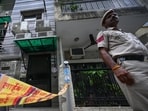 Police officials outside the house in F Block, Lajpat Nagar I, where the bodies of a mother and her son were found in New Delhi, on Thursday. Police officials outside the house in F Block, Lajpat Nagar I, where the bodies of a mother and her son were found in New Delhi, on Thursday.