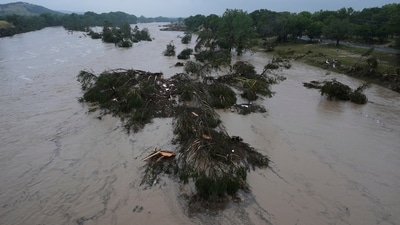 A raging Guadalupe River leaves fallen trees and debris in its wake, Friday, July 4, 2025, in Kerrville, Texas. (AP) A raging Guadalupe River leaves fallen trees and debris in its wake, Friday, July 4, 2025, in Kerrville, Texas. (AP)