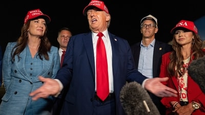 President Donald Trump, center, speaks with reporters as, from left, Agriculture Secretary Brooke Rollins, Rep. Zachary Nunn, R-Iowa, Rep. Randy Feenstra, R-Iowa, and Homeland Security Secretary Kristi Noem listen as they arrive on Air Force One, Friday, July 4, 2025, at Joint Base Andrews, Md. (AP)