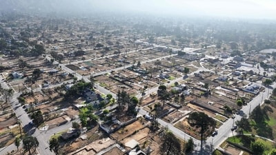 An aerial view of properties cleared of wildfire debris which burned in the Eaton Fire in Altadena, California. (AFP) An aerial view of properties cleared of wildfire debris which burned in the Eaton Fire in Altadena, California. (AFP)