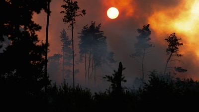 The sun is seen covered by the thick smoke rising from wildfire burning in California (Reuters)