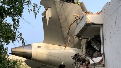 The tail of Air India flight 171 is pictured after it crashed in a residential area near the airport in Ahmedabad on June 12, 2025. (AFP) The tail of Air India flight 171 is pictured after it crashed in a residential area near the airport in Ahmedabad on June 12, 2025. (AFP)