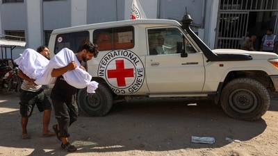 Palestinian men carry the body of a person reportedly killed while waiting for aid delivery in Gaza City, on July 3, 2025. (AFP) Palestinian men carry the body of a person reportedly killed while waiting for aid delivery in Gaza City, on July 3, 2025. (AFP)