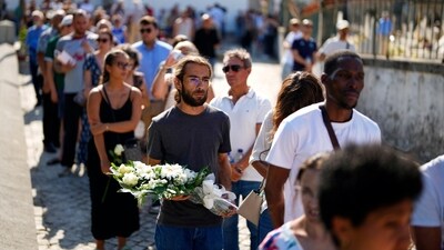 People stand in queues outside the chapel where the wake of the Liverpool star and his brother was organised. (AP Photo/Manu Fernandez) (AP) People stand in queues outside the chapel where the wake of the Liverpool star and his brother was organised. (AP Photo/Manu Fernandez) (AP)