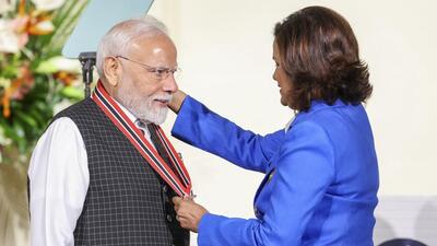 Prime Minister Narendra Modi being conferred with 'The Order of the Republic of Trinidad and Tobago' - the country's highest civilian honour, by Trinidad and Tobago President Christine Carla Kangaloo during a ceremony at the President’s House, in Trinidad and Tobago. (@MEAIndia/via PTI) Prime Minister Narendra Modi being conferred with 'The Order of the Republic of Trinidad and Tobago' - the country's highest civilian honour, by Trinidad and Tobago President Christine Carla Kangaloo during a ceremony at the President’s House, in Trinidad and Tobago. (@MEAIndia/via PTI)