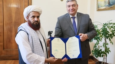 The newly appointed Taliban envoy to Moscow, Gul Hassan, hands "copies" of his credence letters to the Deputy Foreign Minister Andrei Rudenko in Moscow. (AFP) The newly appointed Taliban envoy to Moscow, Gul Hassan, hands "copies" of his credence letters to the Deputy Foreign Minister Andrei Rudenko in Moscow. (AFP)