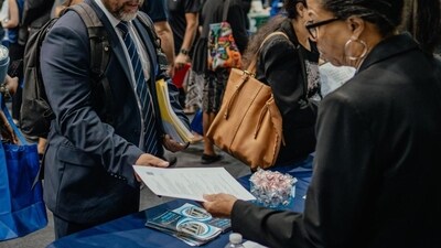 Recruiters and job seekers at a job fair in Chicago. Recruiters and job seekers at a job fair in Chicago.