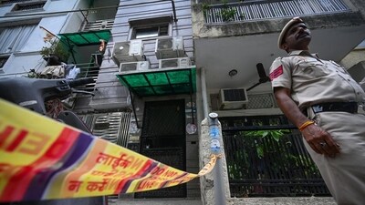 Police officials outside the house in F Block, Lajpat Nagar I, where the bodies of a mother and her son were found in New Delhi, on Thursday. (Sanchit Khanna/HT) Police officials outside the house in F Block, Lajpat Nagar I, where the bodies of a mother and her son were found in New Delhi, on Thursday. (Sanchit Khanna/HT)