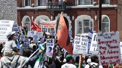 Protestors marched against ongoing ICE raids in the Boyle Heights neighborhood on July 01 in Los Angeles. Organizers called on protestors to call out sick from work and join. (AFP) Protestors marched against ongoing ICE raids in the Boyle Heights neighborhood on July 01 in Los Angeles. Organizers called on protestors to call out sick from work and join. (AFP)