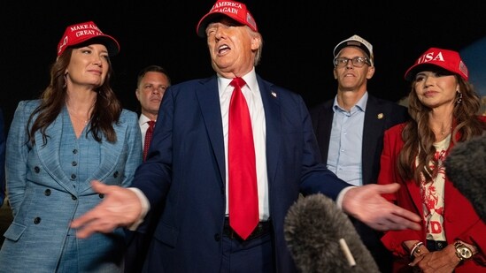 President Donald Trump, center, speaks with reporters as, from left, Agriculture Secretary Brooke Rollins, Rep. Zachary Nunn, R-Iowa, Rep. Randy Feenstra, R-Iowa, and Homeland Security Secretary Kristi Noem listen as they arrive on Air Force One, Friday, July 4, 2025, at Joint Base Andrews, Md. (AP)