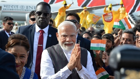 Prime Minister Prime Minister Narendra Modi greets people after arrival at Piarco International Airport in Port of Spain, Trinidad and Tobago on July 3, 2025. (AFP)