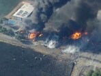 In this aerial image taken from video, smoke and flames rise from a fireworks warehouse explosion In this aerial image taken from video, smoke and flames rise from a fireworks warehouse explosion