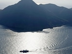 An aerial view shows a ferry carrying residents and visitors evacuating from Akuseki Island, as multiple earthquakes hit the island in Japan.