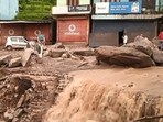 People stand near silt and debris after cloudburst-triggered flash floods at Karsog, in Mandi district, People stand near silt and debris after cloudburst-triggered flash floods at Karsog, in Mandi district,