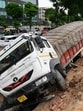 The truck driver said after noticing a heap of mud, he took a slight turn but his vehicle plunged into the sinkhole. (Sanjeev Sharma/HT)