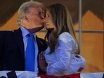 U.S. President Donald Trump kisses first lady Melania Trump as they stand at a balcony to watch the  during Fourth of July celebrations at the White House, in Washington, D.C., U.S., July 4, 2025. REUTERS/Ken Cedeno