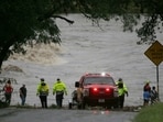 First responders scan the banks of the Guadalupe River for individuals swept away by flooding in Ingram, Texas, First responders scan the banks of the Guadalupe River for individuals swept away by flooding in Ingram, Texas,